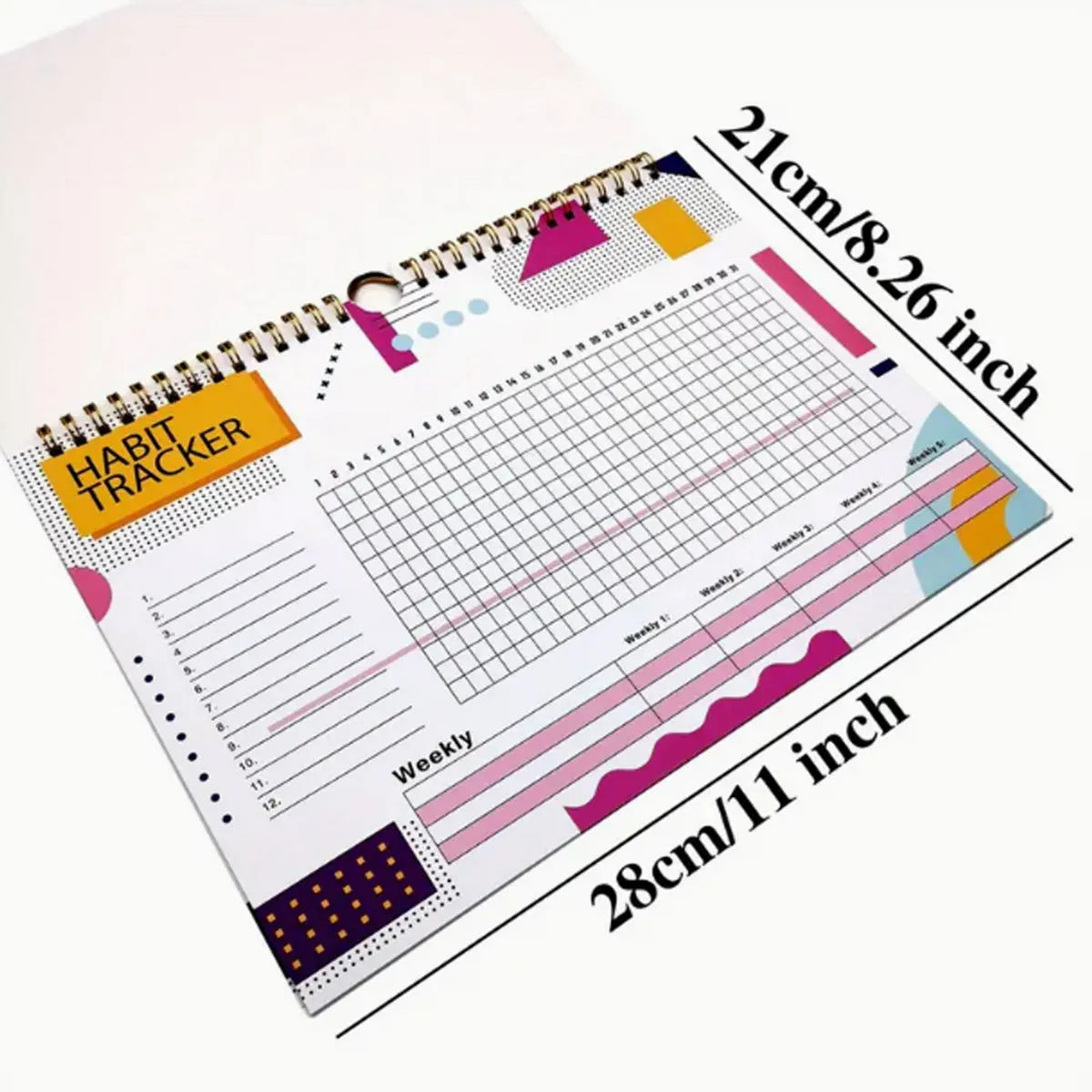 A5 habit tracking notebook open on a desk, showing internal pages, available in four colour options.