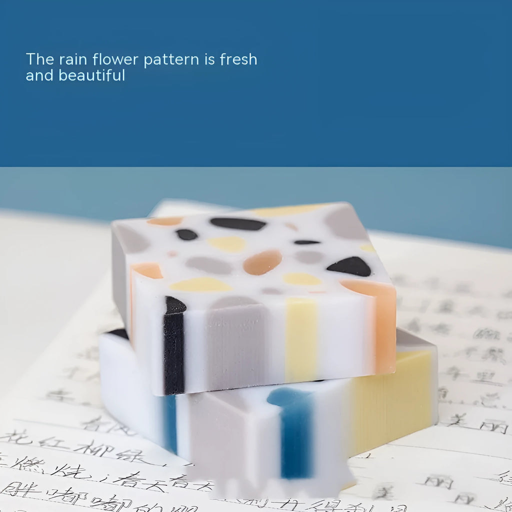 A white brick-shaped soft rubber eraser for traceless pencil correction.
