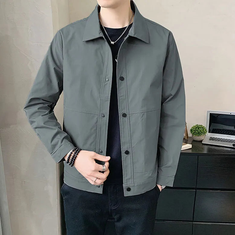 Men's Korean style single-layer lightweight jacket in blue grey, showing long sleeves and stitching detail.