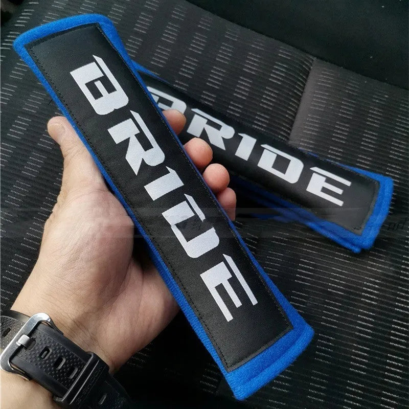 Car safety belt shoulder pad set in black, blue, or red colours, made from cotton sponge cloth.