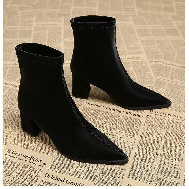 Women's khaki pointed toe fashion boots with a wedge heel on a neutral background.
