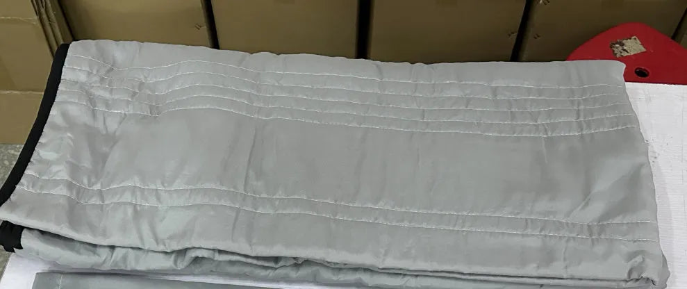 Lightweight seersucker summer quilt in various colours on a bed