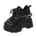 Women's white mesh platform sports shoes with cross strap and thick rubber sole.