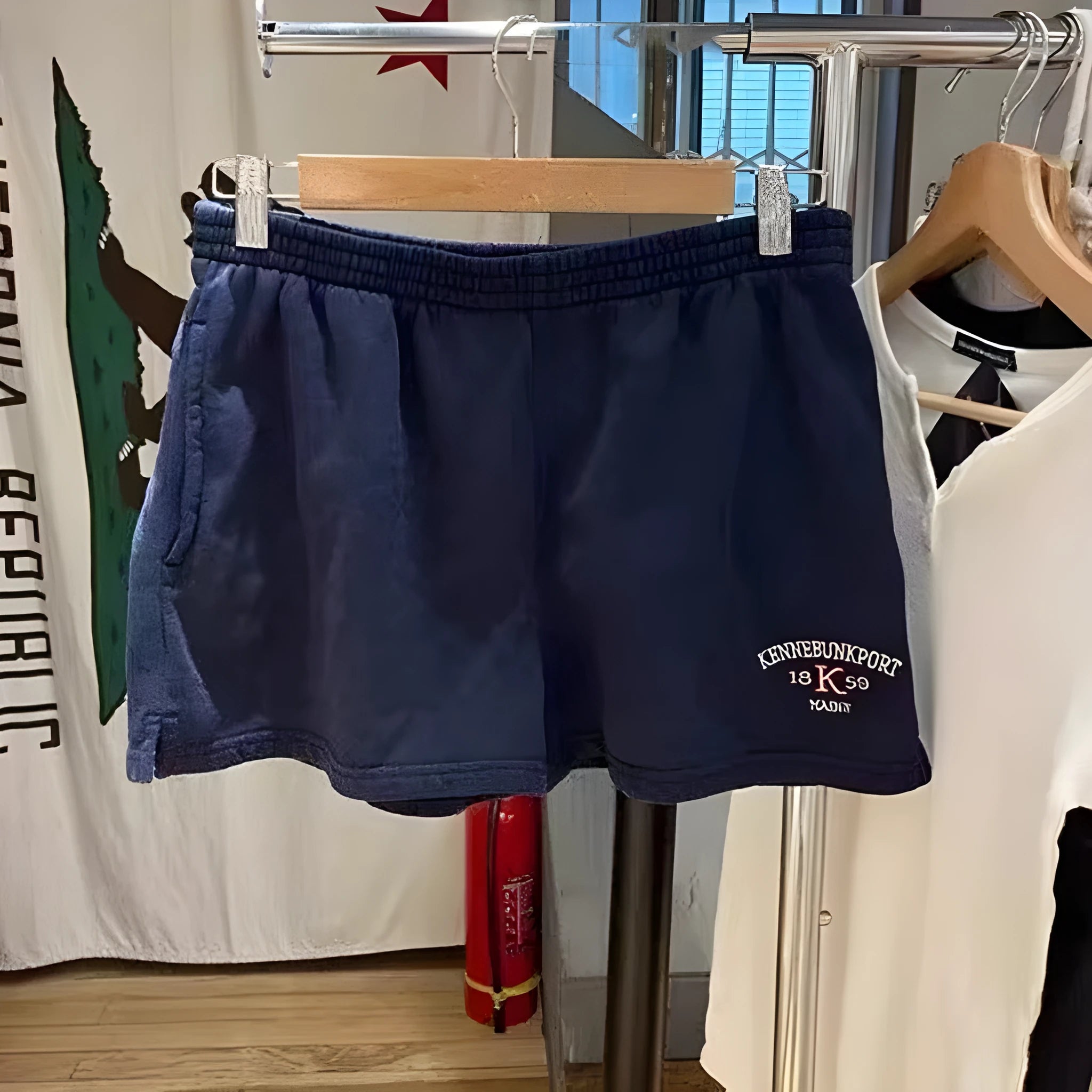 Women's dark blue cotton high top sports shorts with white flag embroidery and navy blue panels