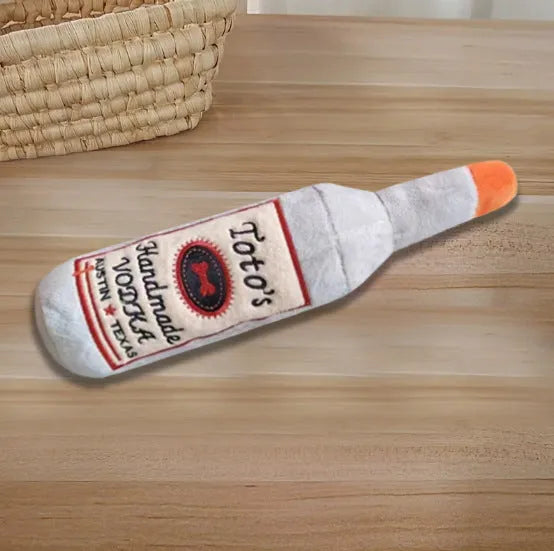 Brown plush wine bottle-shaped dog chew toy with squeaker for aggressive chewers