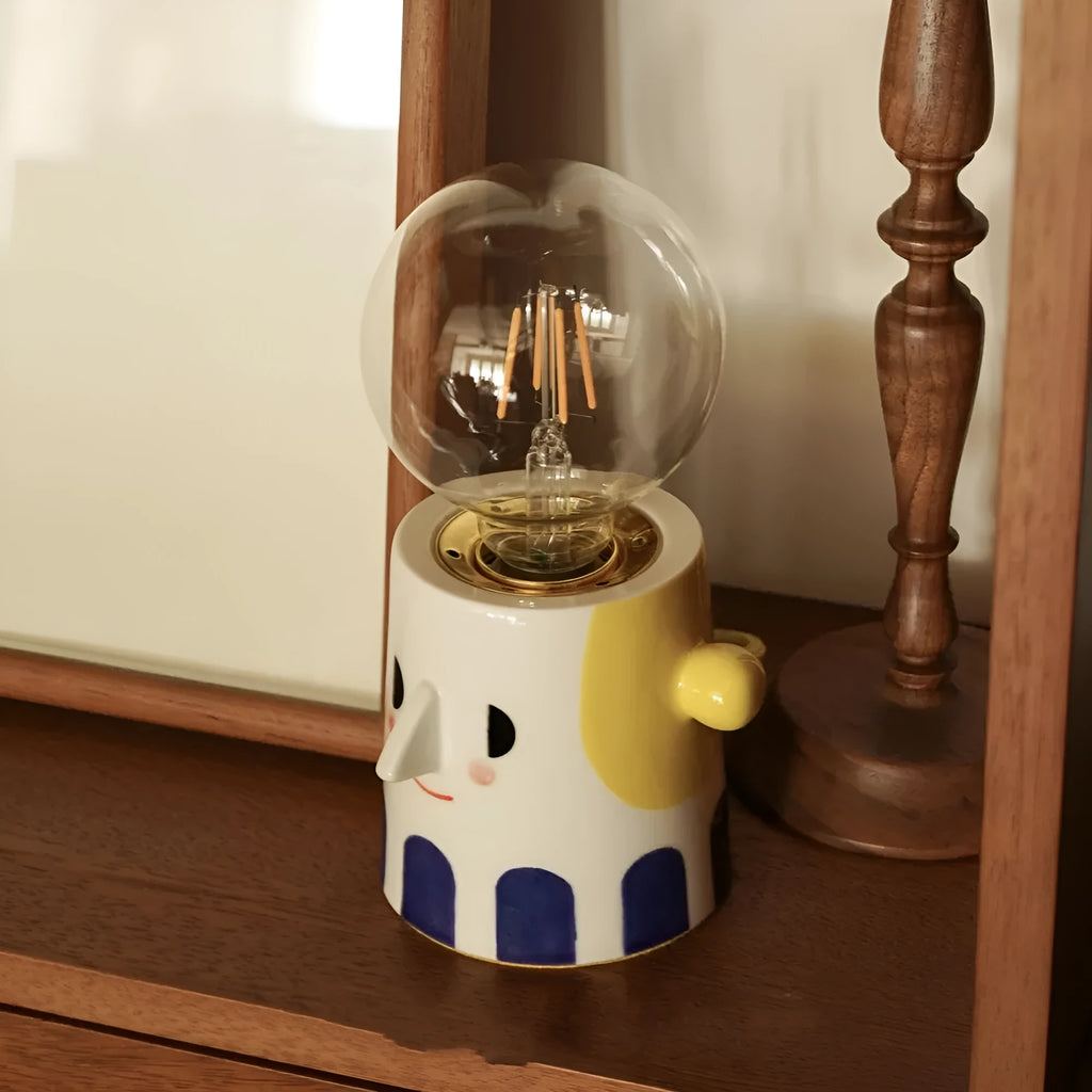 Handmade ceramic table lamp with a white spherical shade on a solid ceramic base, showcasing its simple design.