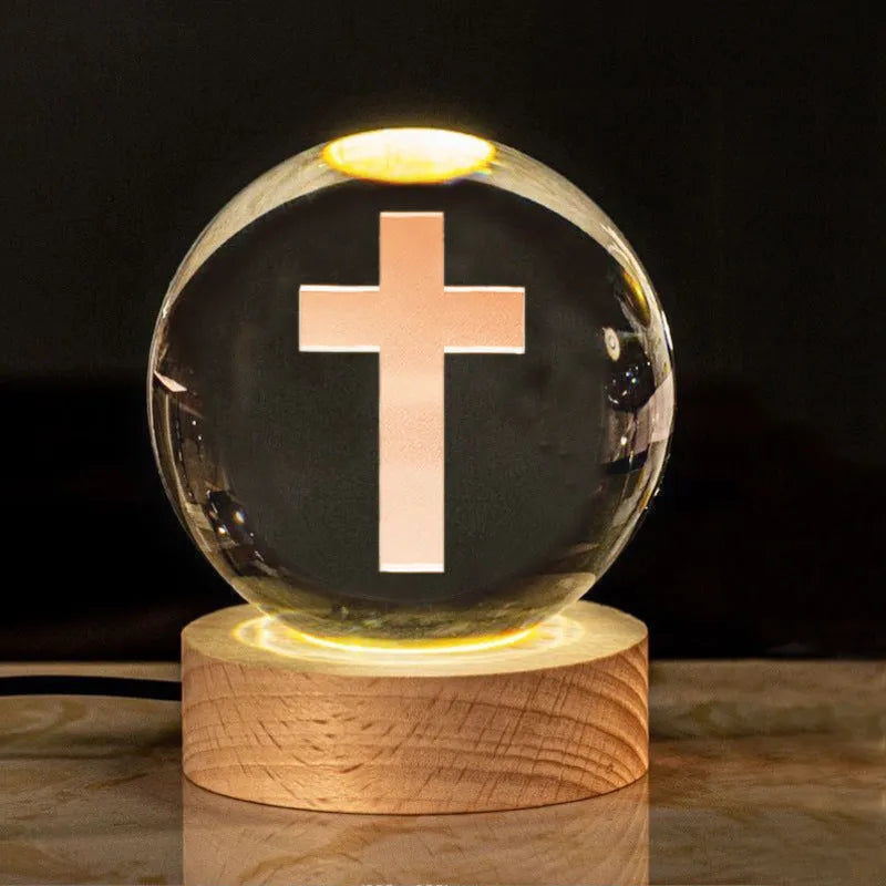 White crystal ball desk ornament on a wooden warm light base, showing purity-themed designs.