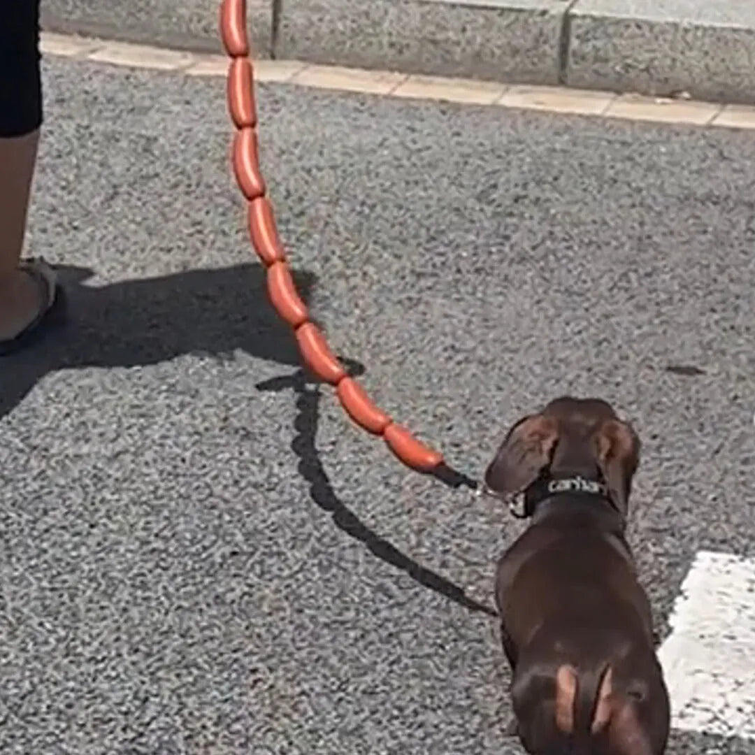 Brown fabric cat play rope with sausage-shaped sections and a grip tape handle, shown at full 108cm length.
