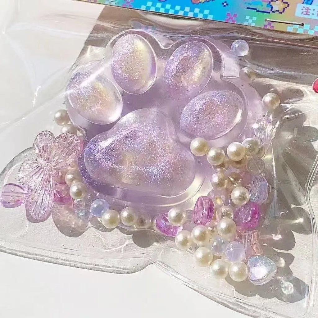 Transparent crystal coloured cat's paw squeezing toy made of soft TPR material