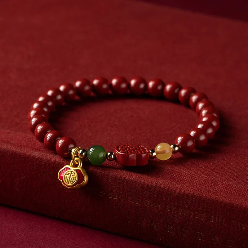 New Chinese style bracelet with emperor sandstone beads and a red Fu character charm.
