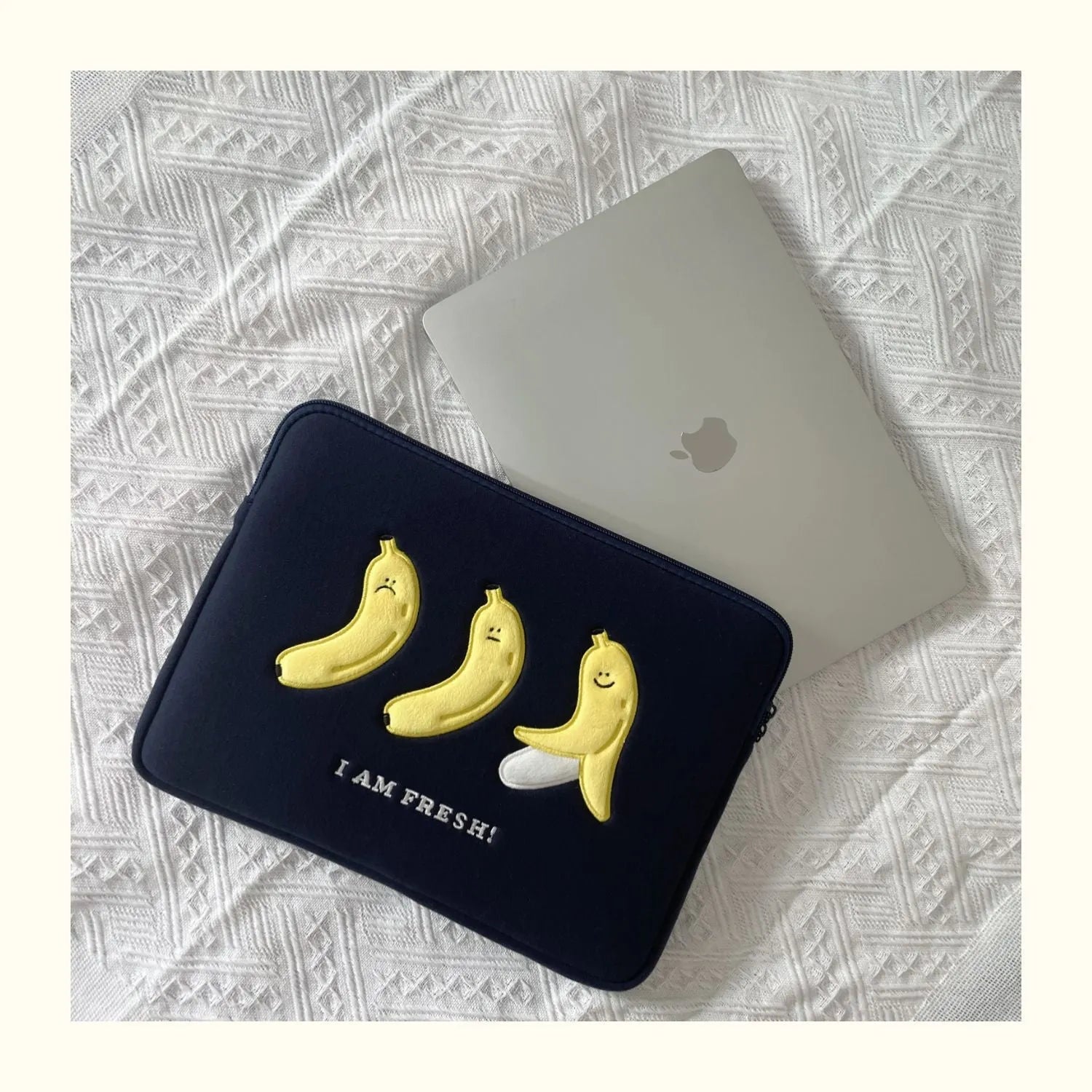 Polyester laptop sleeve with colourful embroidered animal design for a 15.6-inch laptop.