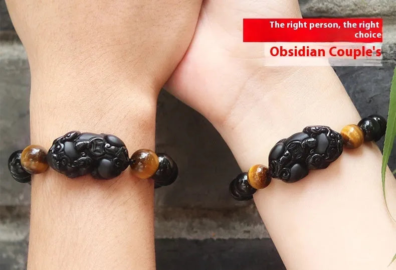 Black Mexico Gold Sheen Obsidian pi xiu bracelet with ethnic styling on wrist