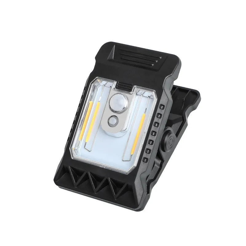 White ABS plastic motion sensor clip lamp with LED light, shown attached to a cupboard door edge.