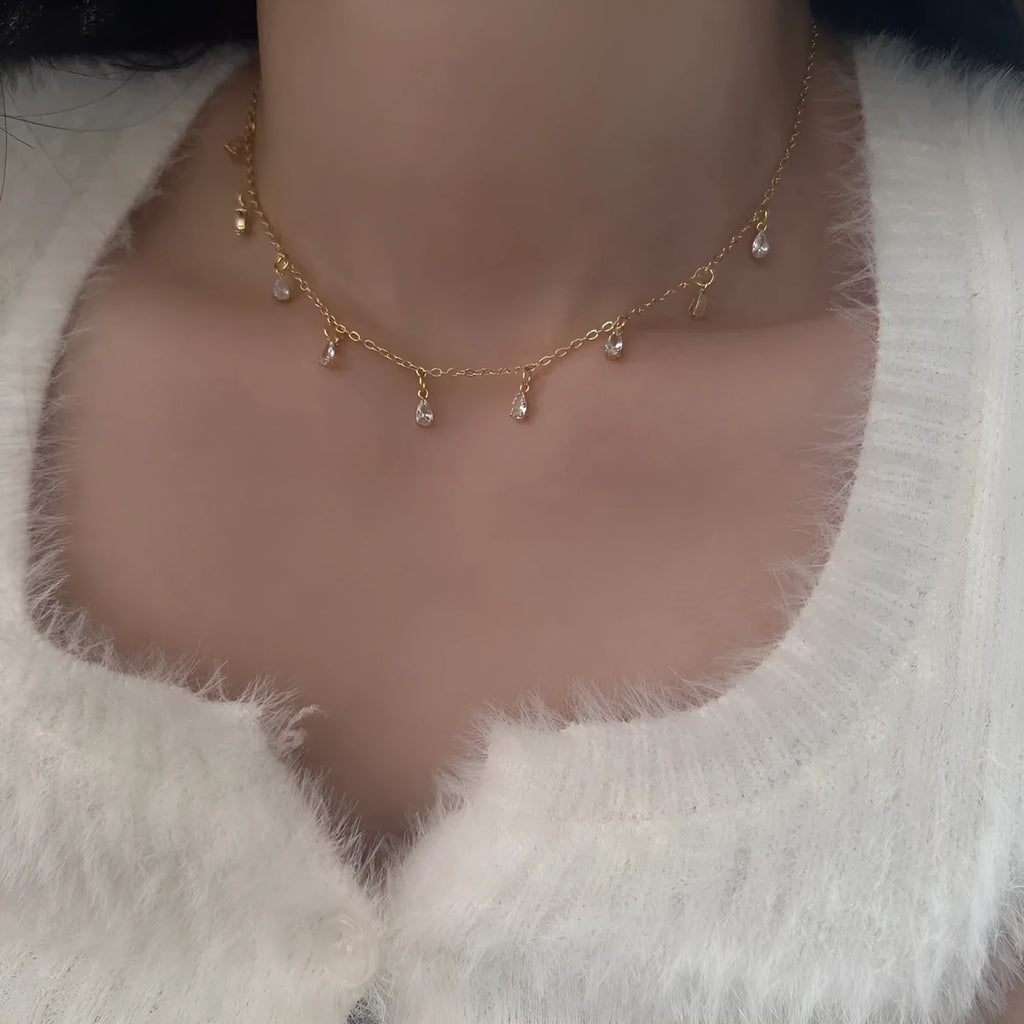 Zircon necklace, earrings, and anklet set with geometric meteor shower design.