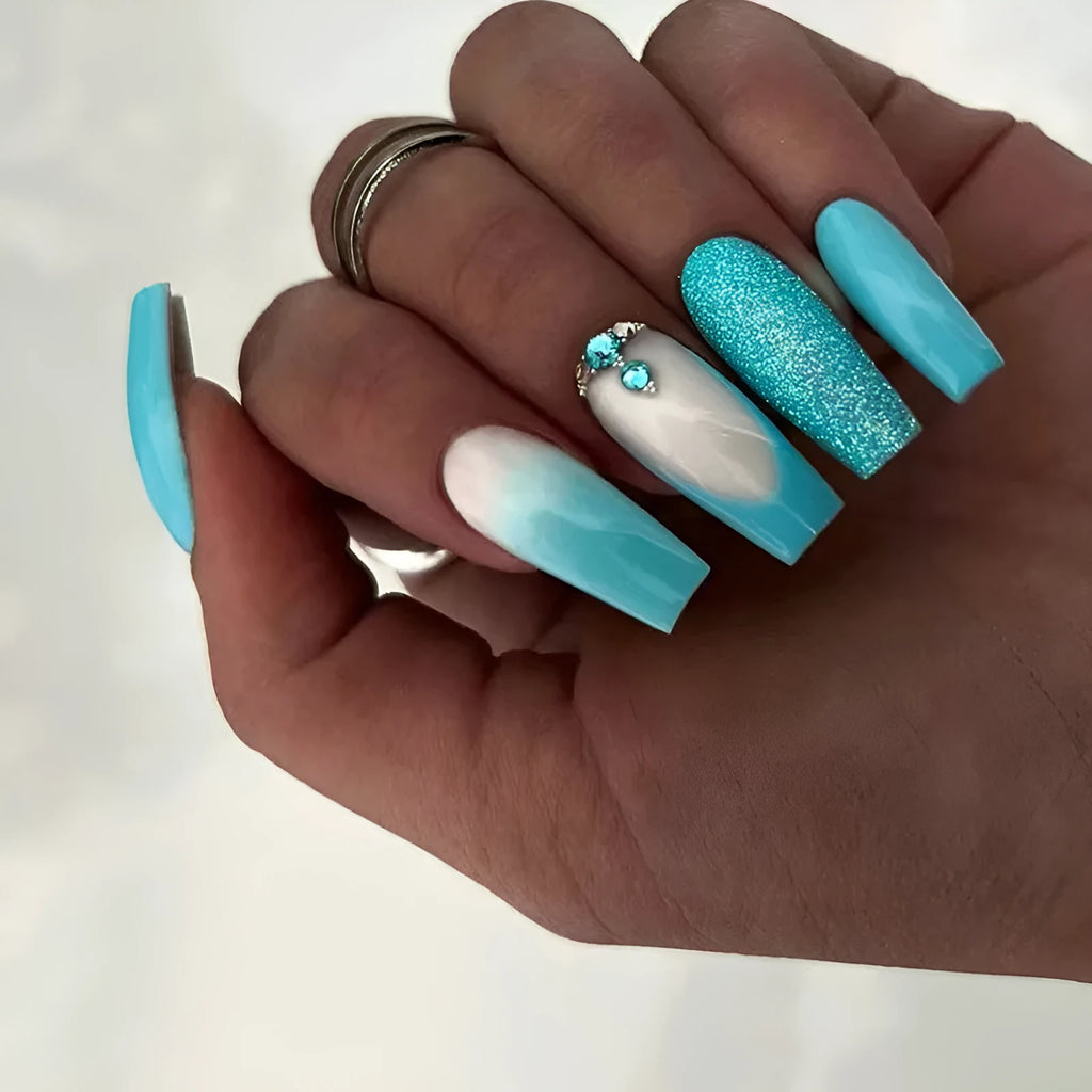 Long ballet shaped press-on nails with solid blue diamond glitter colour.