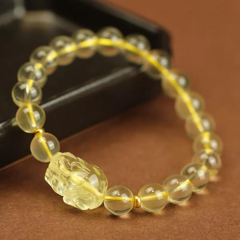 Yellow leather bracelet with citrine artificial crystal beads and Pi Xiu charm in Chinese national style.