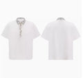 Loose fit black square neck short sleeve shirt with sequin and metal decoration details.