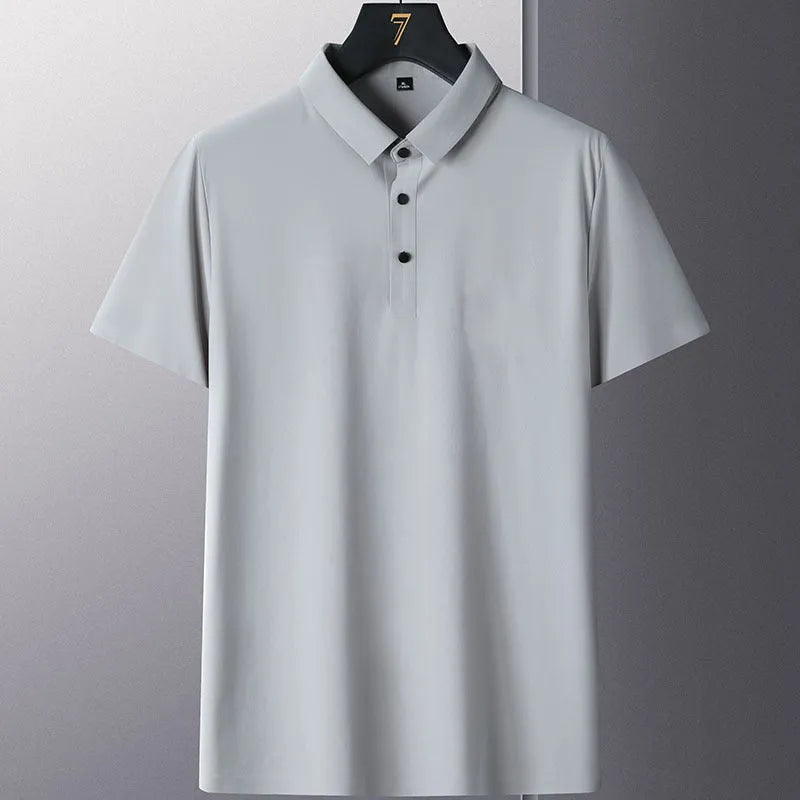 Man wearing a solid colour short sleeve non-ironing business casual shirt in a neutral tone.