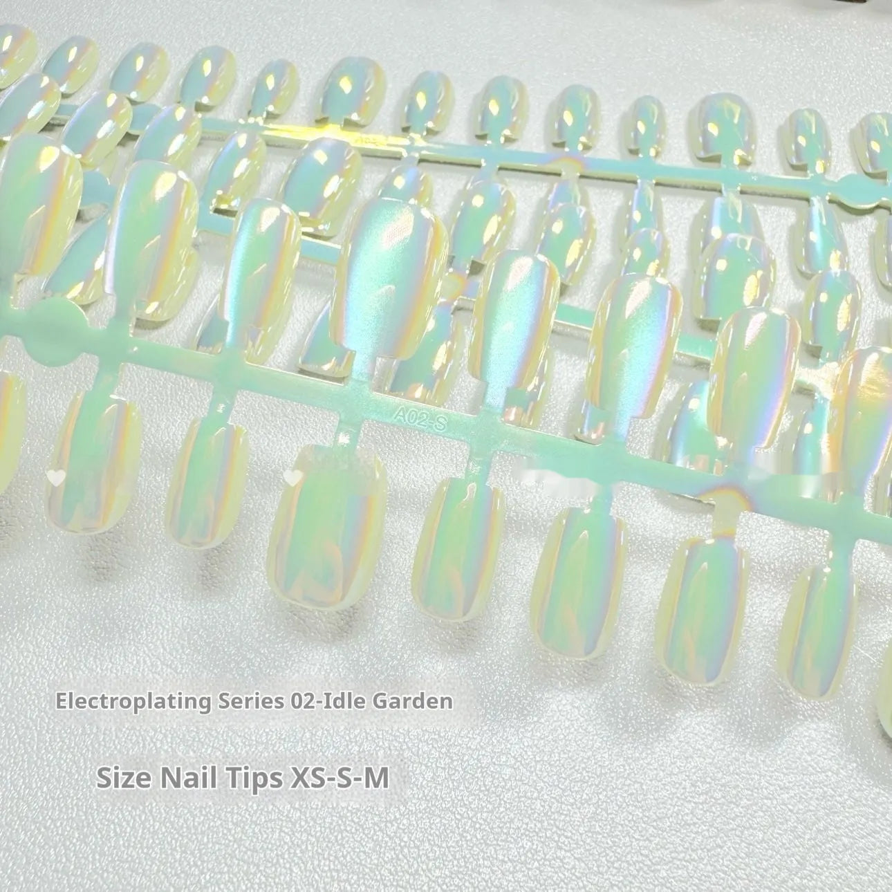 Electroplated Cat's Eye aurora armour false nail set in short ladder sizes XS, S, M.