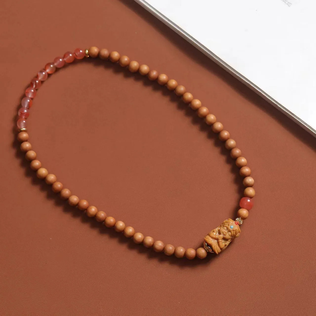 Brown wooden bracelet with South Red Zachilam double circle design showing 6mm round beads