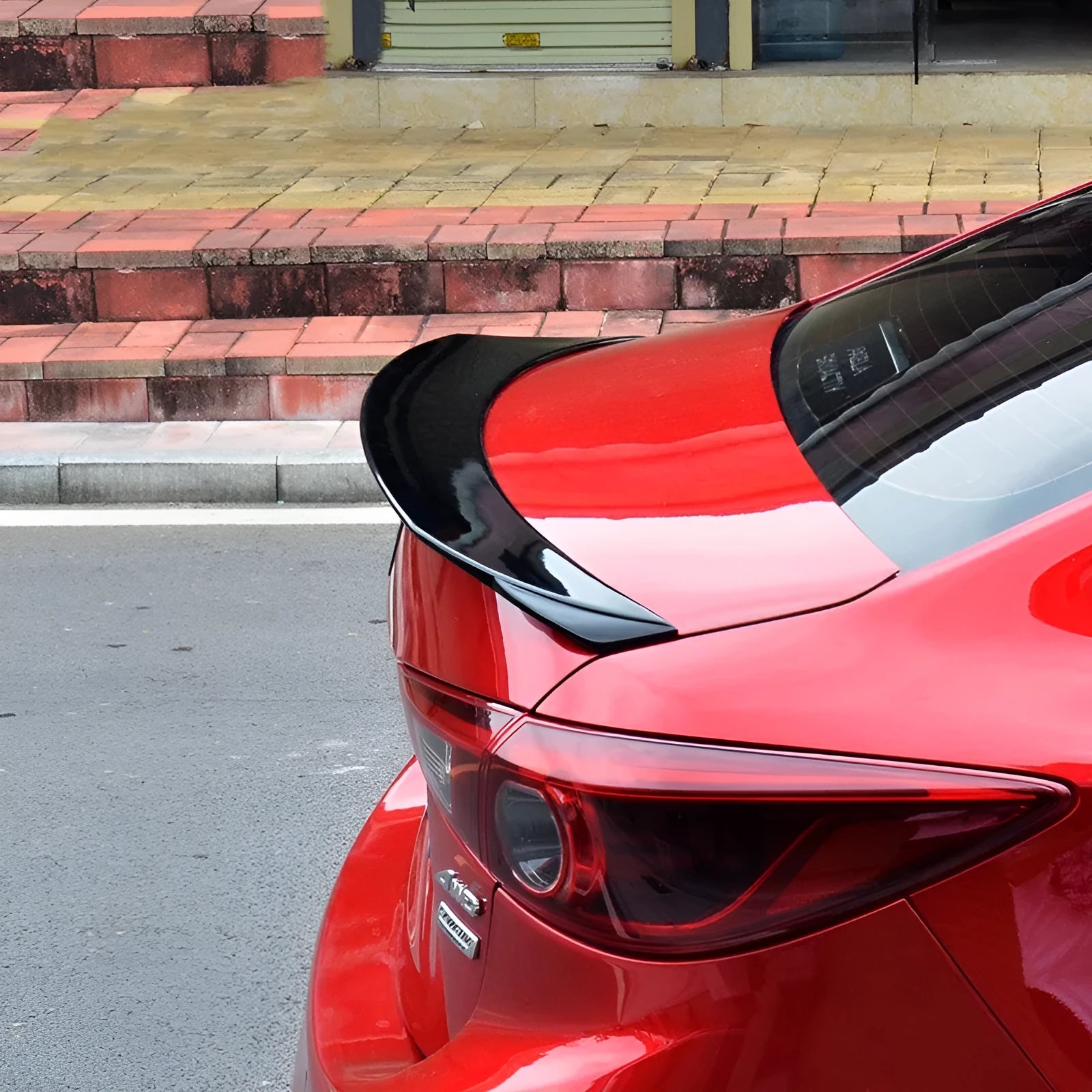 Bright black blade-style tail trim with large fixed wing spoiler for Mazda 3 Axela Exela Model 14-21.