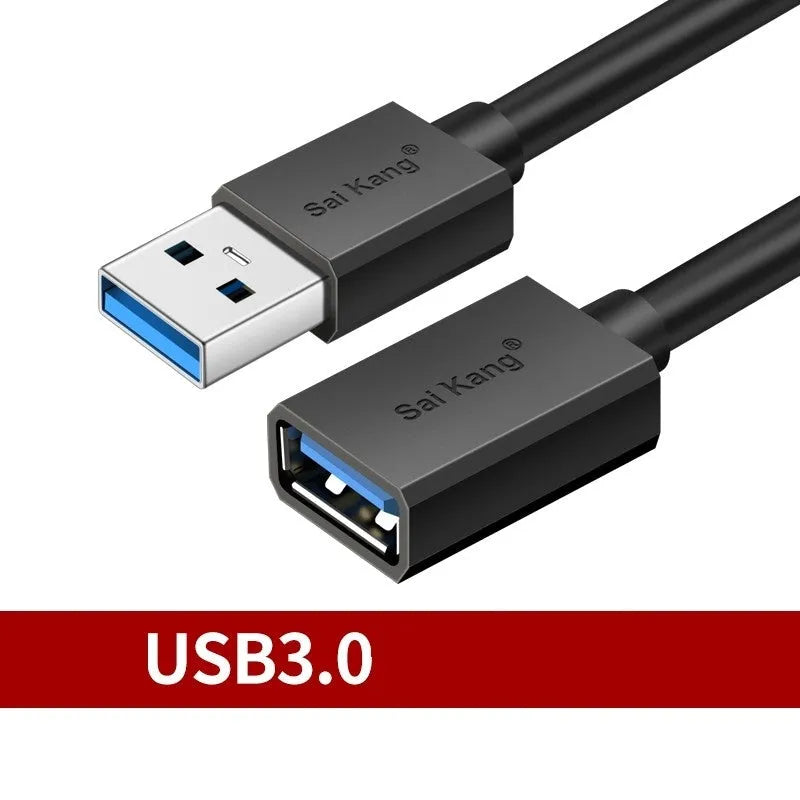 Black USB male to female extension cable on a desk, showing connector ends.