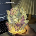 Handmade butterfly night lamp with glass shade and raw wood base measuring 12x15cm