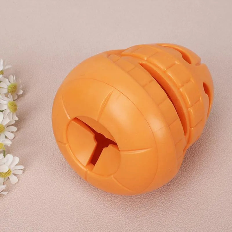 Yellow pumpkin-shaped TPR dog chew toy measuring 8.6x11.5cm for aggressive chewers