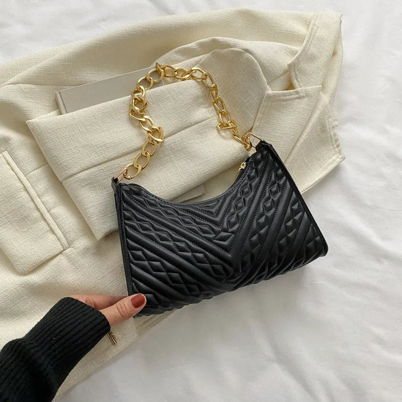 Black PU leather pleated square baguette bag with chain shoulder strap and top handle.
