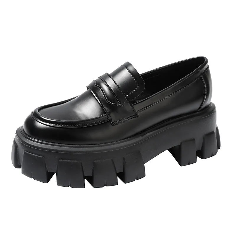 British style wide fit patent leather loafers with a rubber sole and muffin heel base.