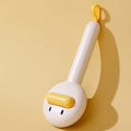Small yellow duck-shaped pet comb for cat and dog grooming with open-section needle design