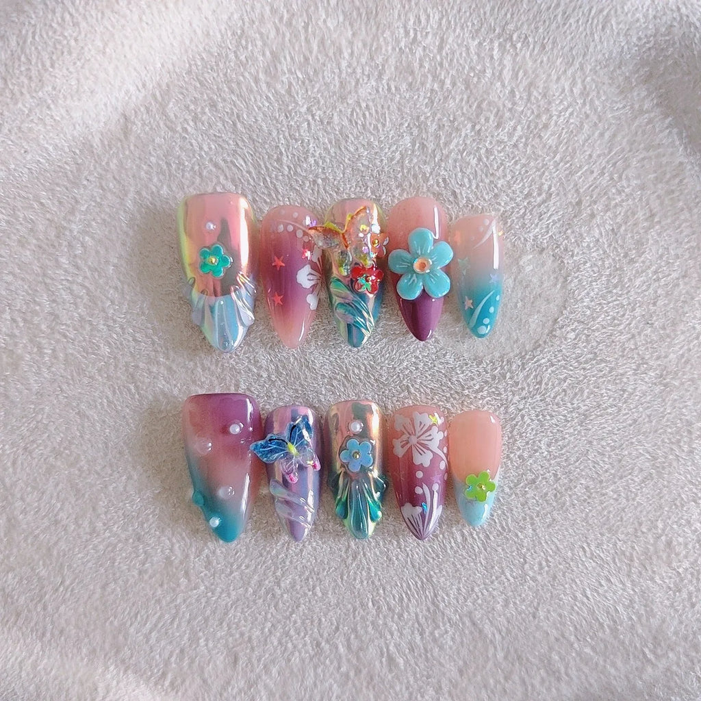 Handmade colourful flower and butterfly nail art decorations in four sizes