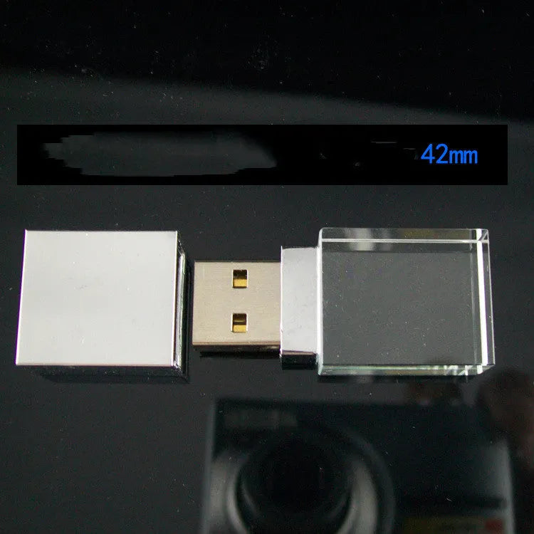DIY luminous creative crystal USB 2.0 flash drive in mini car shape with transparent shell on a dark surface