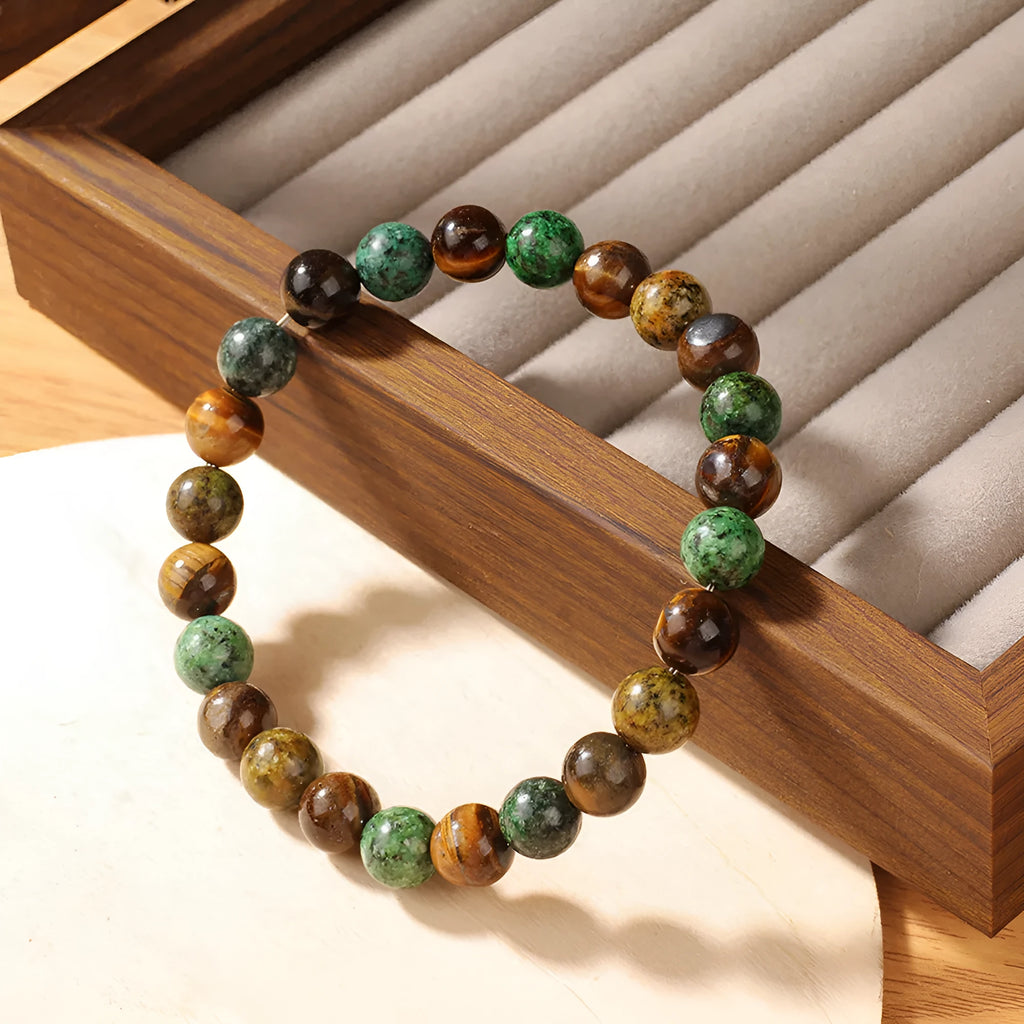 Tiger eye stone bracelet showing antique flower design with natural stone beads