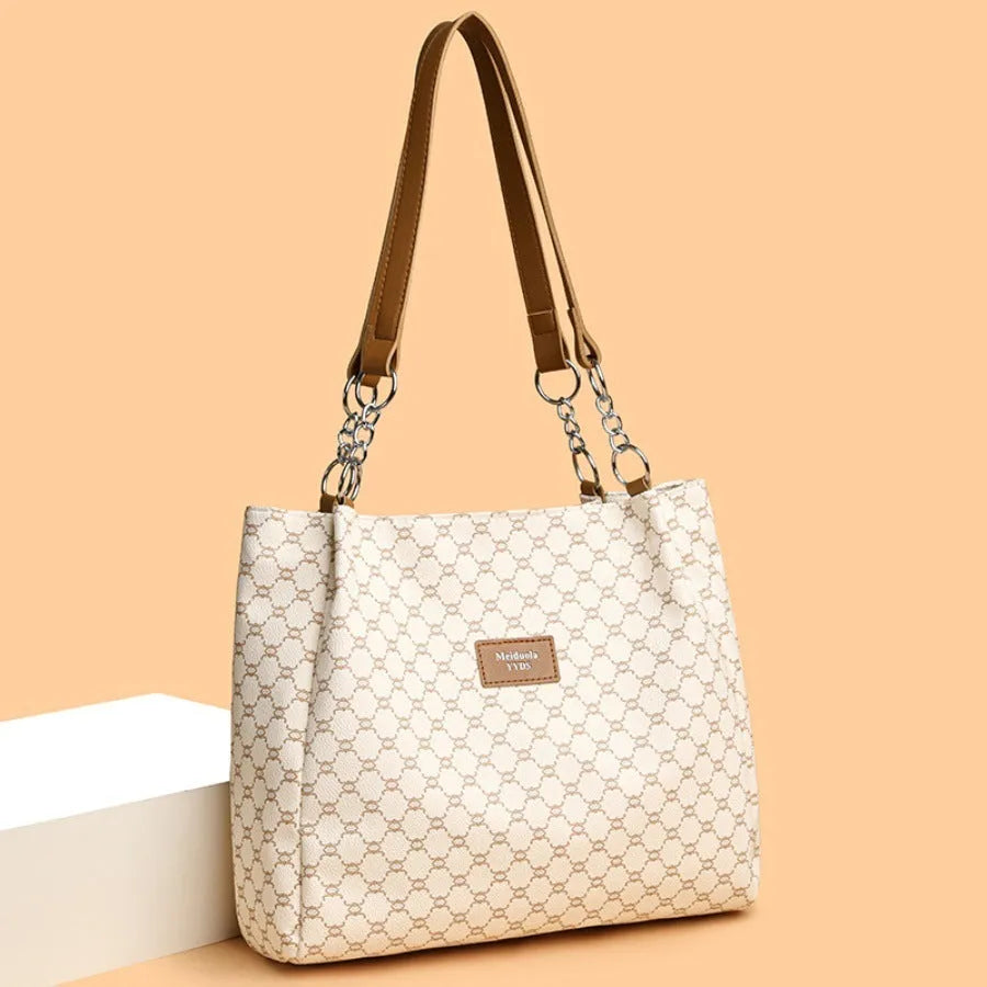 Retro women's handbag in soft brown PU leather with polyester lining.