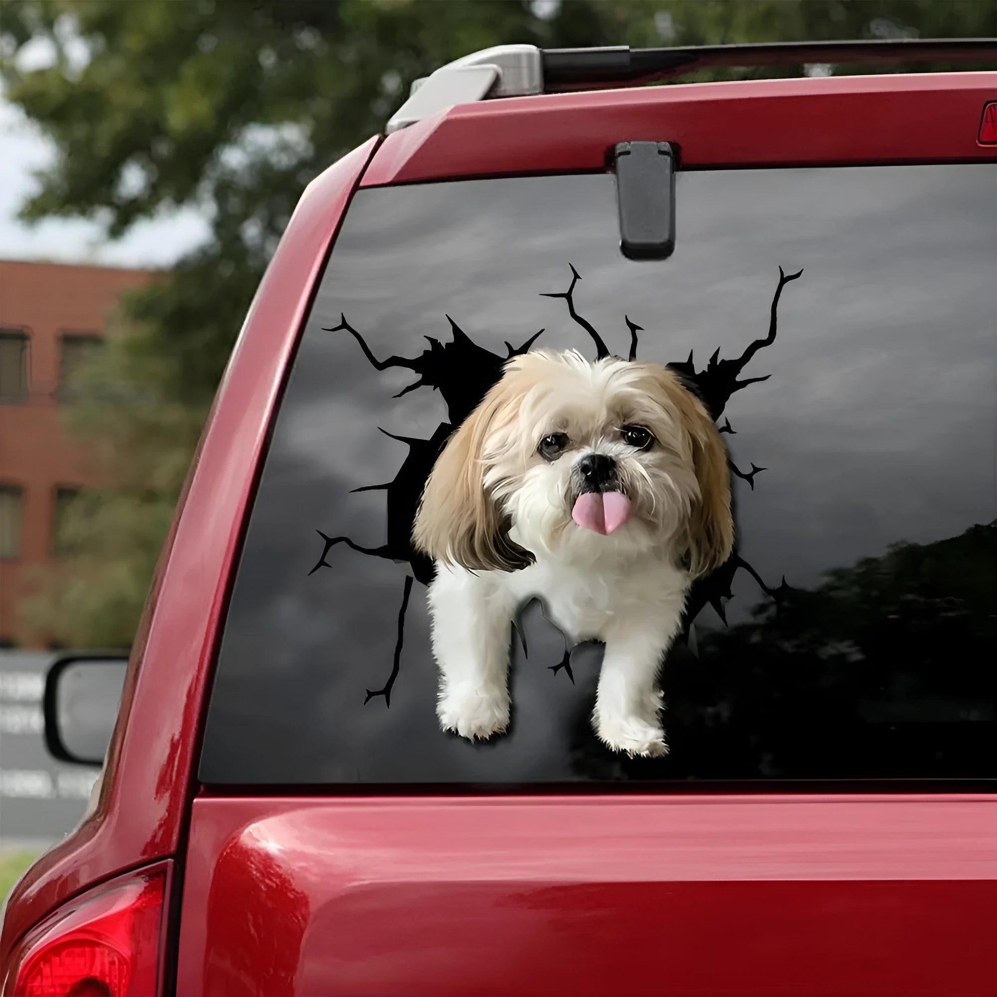 A reflective window sticker showing a funny tear-away design of a dog's body, available in small, medium, and large sizes.