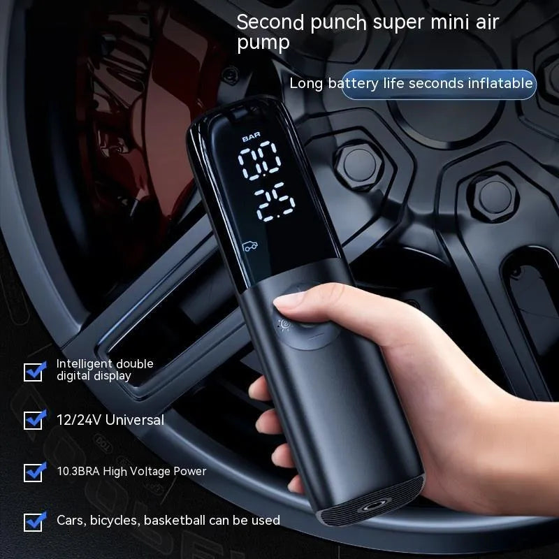 Black portable car tyre inflator with pressure gauge and plug connection