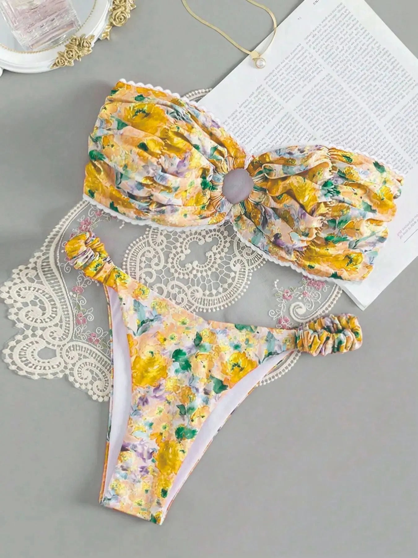 Women's polyester bikini set with floral print tube top and matching briefs for swimming.