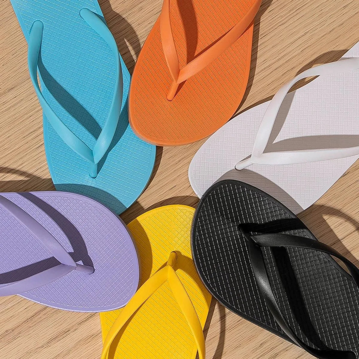 Foldable beach slippers with non-slip PVC soles shown in multiple colour options