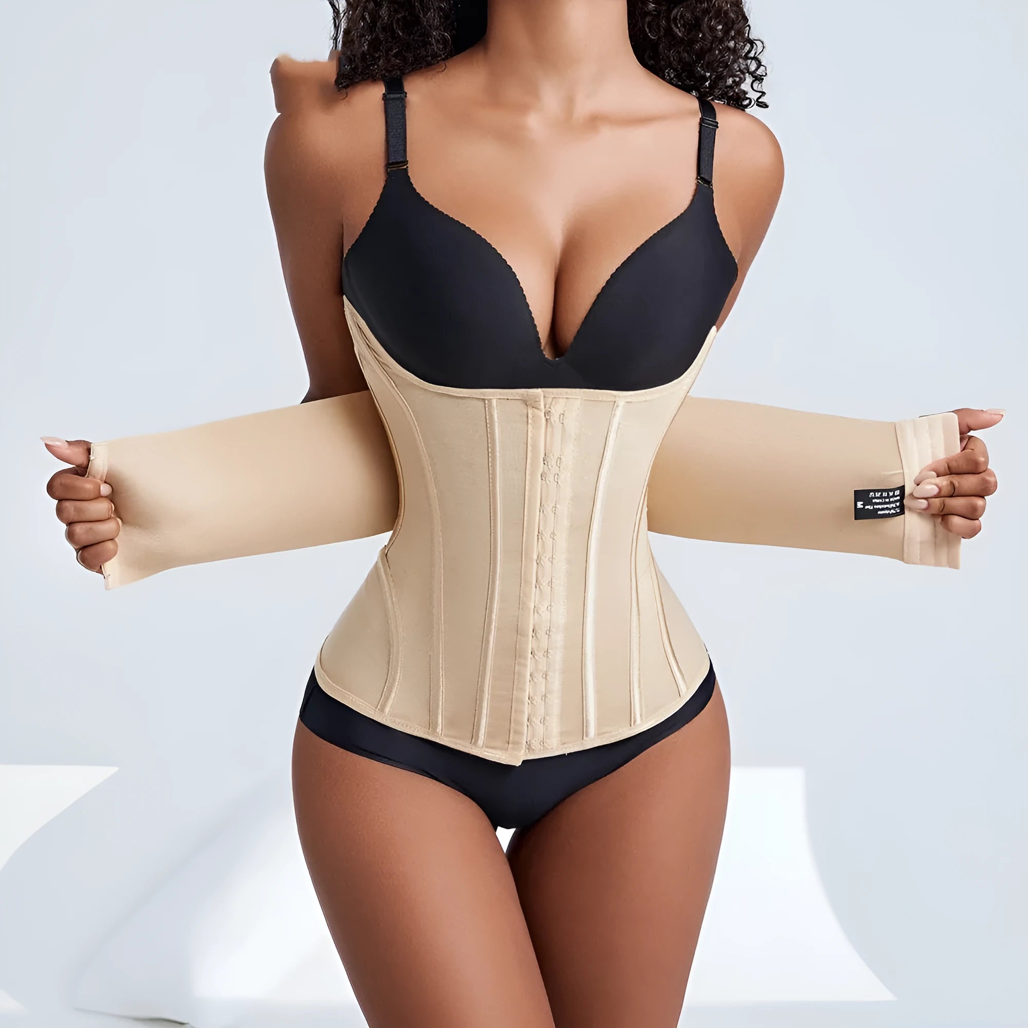Nylon belly band for waist training in black or apricot, showing adjustable tie.