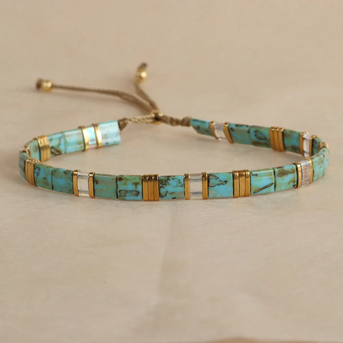 Geometric beaded bracelet with round glass and coloured glaze beads in five colour options.