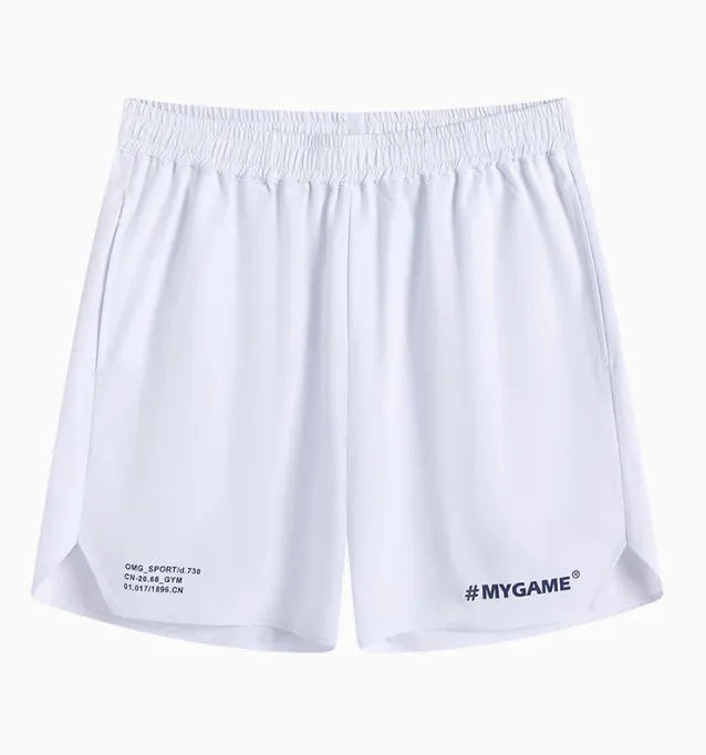 Men's grey fitness shorts with a four-point training design, shown on a model, highlighting the short length and elastic fabric.
