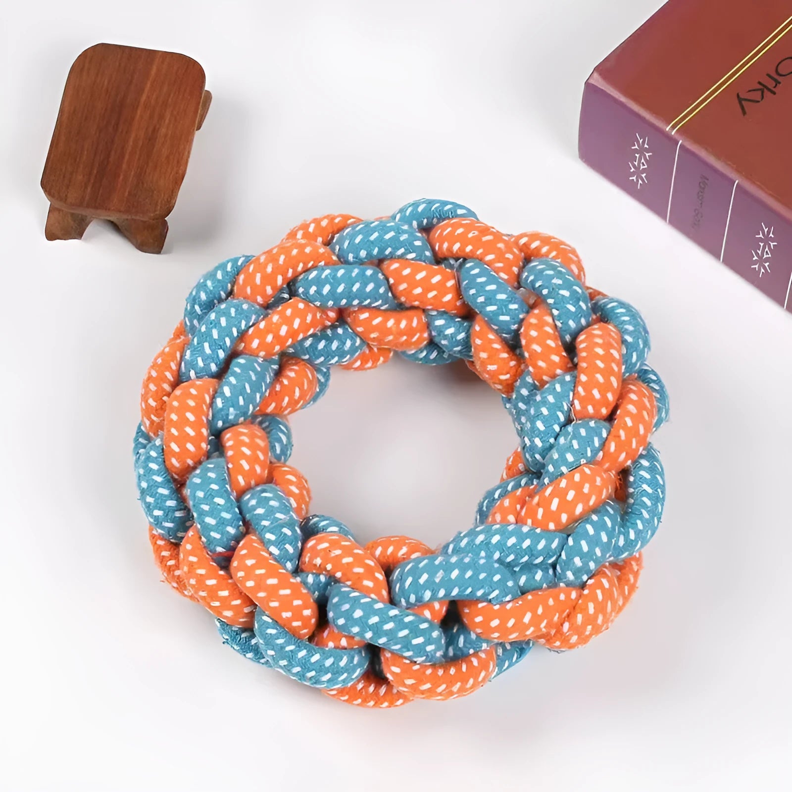 Natural cotton braided ring dog chew toy showing woven knot texture