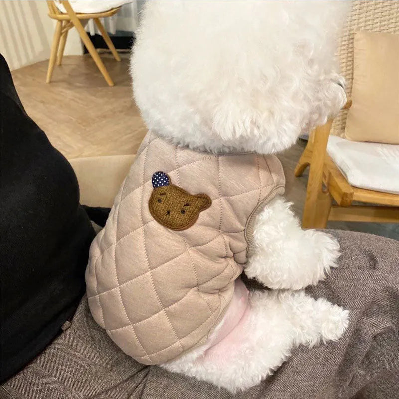 Quilted pet vest with bear patch embroidery on cream background for small dogs