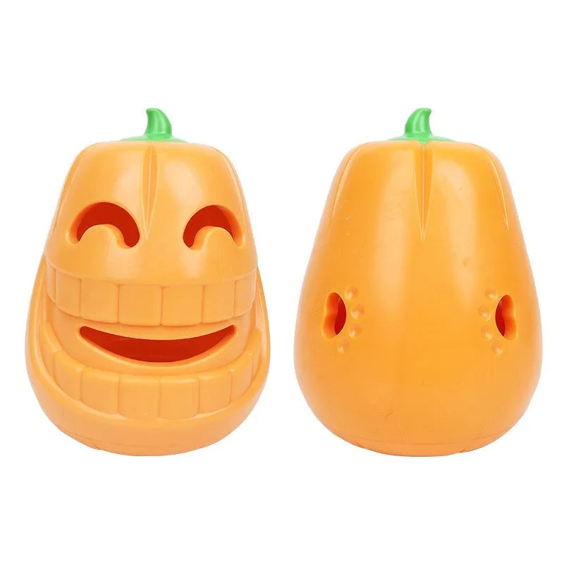 Orange Halloween pumpkin shaped dog chew toy with a black treat-dispensing funnel on top.