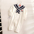 Navy style long-sleeved baby onesie with detachable hood and single-breasted snap closure.
