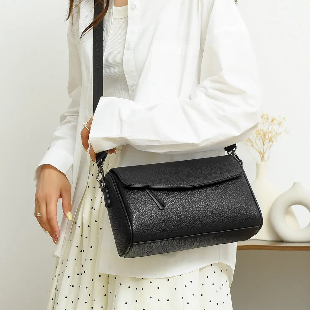 Casual simple women's shoulder messenger bag in black genuine leather with double shoulder straps and lined interior.