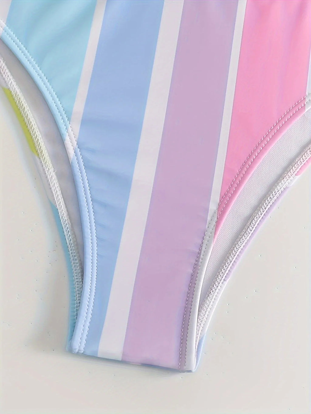 Women's striped two-piece sports bikini set in picture colour, shown for swimming.