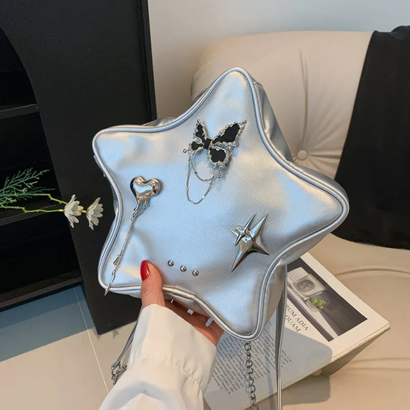 Black PU leather decorative backpack with metal butterfly love pendant and five-pointed star, chain strap.