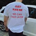 Men's printed short sleeve cotton t-shirt on a hanger showing street fashion design.